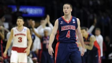 Mar 28, 2015; Los Angeles, CA, USA; Arizona Wildcats guard T.J. McConnell (4) reacts against Wisconsin Badgers during the first half in the finals of the west regional of the 2015 NCAA Tournament at Staples Center. Mandatory Credit: Robert Hanashiro-USA TODAY Sports