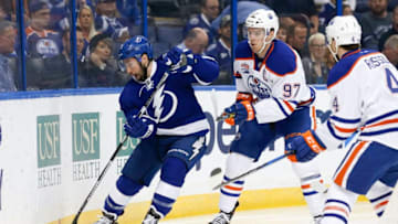 ST. PETERSBURG, FL - FEBRUARY 21: Tampa Bay Lightning center Tyler Johnson (9) and Edmonton Oilers center Connor McDavid (97) battle for the puck in the first period of the NHL game between the Edmonton Oilers and Tampa Bay Lightning on February 21, 2017, at Amalie Arena in Tampa, FL. (Photo by Mark LoMoglio/Icon Sportswire via Getty Images)