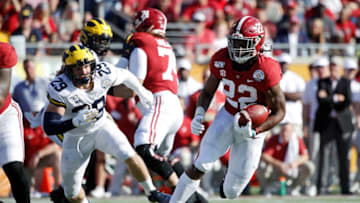 ORLANDO, FL - JANUARY 01: Najee Harris #22 of the Alabama Crimson Tide heads for the end zone on a nine-yard touchdown run against the Michigan Wolverines in the second quarter of the Vrbo Citrus Bowl at Camping World Stadium on January 1, 2020 in Orlando, Florida. (Photo by Joe Robbins/Getty Images)