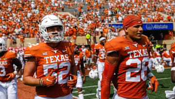 Texas Football.Linebacker Jett Bush, left, and defensive back Jerrin Thompson, right, take the field during Texas's game against Louisiana at Darrell K. Royal Stadium on Sept. 4, 2021.Aem Ut Louisiana 60