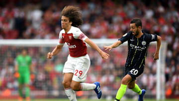 LONDON, ENGLAND - AUGUST 12: Sergio Aguero of Manchester City chases down Matteo Guendouzi of Arsenal during the Premier League match between Arsenal FC and Manchester City at Emirates Stadium on August 12, 2018 in London, United Kingdom. (Photo by Shaun Botterill/Getty Images)
