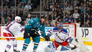 SAN JOSE, CA - MARCH 19: Joe Thornton #19 of the San Jose Sharks spots the puck in front of the net of the New York Rangers during a NHL game at the SAP Center at San Jose on March 19, 2016 in San Jose, California. (Photo by Nick Lust/NHLI via Getty Images)