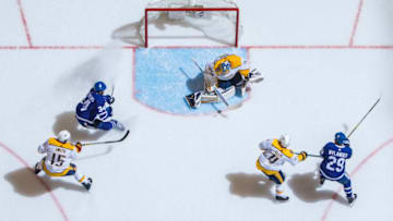 TORONTO, ON - JANUARY 7: Pekka Rinne #35 of the Nashville Predators makes a save against Auston Matthews #34 of the Toronto Maple Leafs during the first period at the Scotiabank Arena on January 7, 2019 in Toronto, Ontario, Canada. (Photo by Mark Blinch/NHLI via Getty Images)