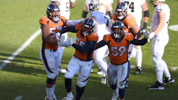 Nov 29, 2020; Denver, Colorado, USA; Denver Broncos outside linebacker Bradley Chubb (55) celebrates his sack with outside linebacker Malik Reed (59) and defensive end DeMarcus Walker (57) in the first quarter against the New Orleans Saints at Empower Field at Mile High. Mandatory Credit: Ron Chenoy-USA TODAY Sports