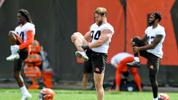 BEREA, OH - JUNE 09: Defensive end Porter Gustin #94, defensive back Robert Jackson #34 and strong safety John Johnson III #43 of the Cleveland Browns stretch during an OTA at the Cleveland Browns training facility on June 9, 2021 in Berea, Ohio. (Photo by Nick Cammett/Getty Images)