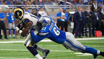 DETROIT, MI - OCTOBER 16: Wide receiver Kenny Britt #18 of the Los Angeles Rams runs with the football pulling defensive end Kerry Hyder #61 of the Detroit Lions for a fourth quarter touchdown during an NFL game at Ford Field on October 16, 2016 in Detroit, Michigan. (Photo by Dave Reginek/Getty Images)