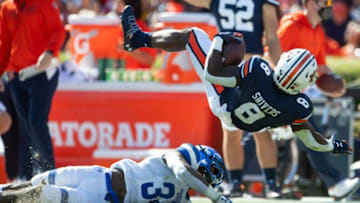 Auburn football running back Shaun Shivers (8) is upended by Georgia State at Jordan-Hare Stadium in Auburn, Ala., on Saturday, Sept. 25, 2021.