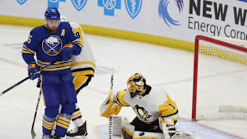 Apr 18, 2021; Buffalo, New York, USA; Pittsburgh Penguins goaltender Casey DeSmith (1) makes a save as Buffalo Sabres defenseman Rasmus Ristolainen (55) looks on during the third period at KeyBank Center. Mandatory Credit: Timothy T. Ludwig-USA TODAY Sports