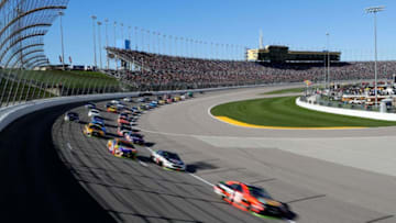 KANSAS CITY, KS - OCTOBER 22: Martin Truex Jr., driver of the #78 Bass Pro Shops/Tracker Boats Toyota, leads a pack of cars during the Monster Energy NASCAR Cup Series Hollywood Casino 400 at Kansas Speedway on October 22, 2017 in Kansas City, Kansas. (Photo by Jamie Squire/Getty Images)