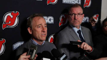 NEWARK, NEW JERSEY - JANUARY 12: New Jersey Devils owner Joshua Harris (L) answers questions from the media after announcing that Tom Fitzgerald (R) has taken over general manager duties prior to a game against the Tampa Bay Lightning at Prudential Center on January 12, 2020 in Newark, New Jersey. The team relieved former general manager Ray Shero earlier in the day. (Photo by Jim McIsaac/Getty Images)