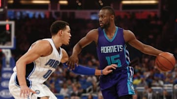Dec 28, 2016; Orlando, FL, USA; Orlando Magic forward Aaron Gordon (00) guards Charlotte Hornets guard Kemba Walker (15) during the first quarter of an NBA basketball game against the at Amway Center. Mandatory Credit: Reinhold Matay-USA TODAY Sports