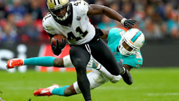 DraftKings: LONDON, ENGLAND - OCTOBER 01: Alvin Kamara of the New Orleans Saints is challenged by Cordrea Tankersley of Miami Dolphins during the NFL match between New Orleans Saints and Miami Dolphins at Wembley Stadium on October 1, 2017 in London, England. (Photo by Clive Rose/Getty Images)