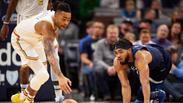 MINNEAPOLIS, MINNESOTA - NOVEMBER 08: Karl-Anthony Towns #32 of the Minnesota Timberwolves looks on as D'Angelo Russell #0 of the Golden State Warriors recovers a loose ball during the game at Target Center on November 8, 2019 in Minneapolis, Minnesota. NOTE TO USER: User expressly acknowledges and agrees that, by downloading and or using this Photograph, user is consenting to the terms and conditions of the Getty Images License Agreement (Photo by Hannah Foslien/Getty Images)
