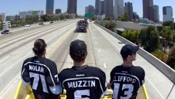 Jun 16, 2014; Los Angeles, CA, USA; Los Angeles Kings players Jordan Nolan (74), Jake Muzzin (6) and Kyle Clifford (13) ride on the 110 freeway before a parade on Figueroa Street to celebrate winning the 2014 Stanley Cup at Staples Center. Mandatory Credit: Kirby Lee-USA TODAY Sports