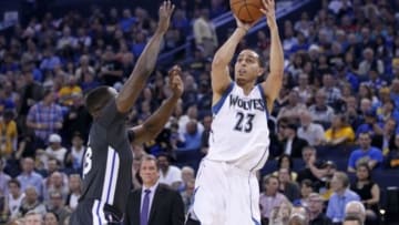 Apr 11, 2015; Oakland, CA, USA; Minnesota Timberwolves guard Kevin Martin (23) attempts a shot over Golden State Warriors forward Draymond Green (23) in the first quarter at Oracle Arena. Mandatory Credit: Cary Edmondson-USA TODAY Sports