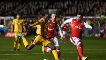 SUTTON, GREATER LONDON - FEBRUARY 20: Alex Oxlade-Chamberlain of Arsenal blocks at shot on goal from Bedsente Gomis of Sutton United during the Emirates FA Cup fifth round match between Sutton United and Arsenal on February 20, 2017 in Sutton, Greater London. (Photo by Mike Hewitt/Getty Images)