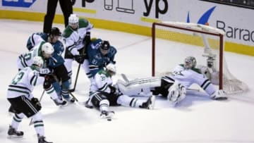 Jan 16, 2016; San Jose, CA, USA; Dallas Stars center Vernon Fiddler (38) defends San Jose Sharks right wing Joonas Donskoi (27) with goalie Antti Niemi (31) during the first period at SAP Center at San Jose. Mandatory Credit: Kelley L Cox-USA TODAY Sports