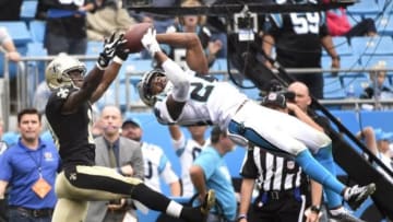 Sep 27, 2015; Charlotte, NC, USA; Carolina Panthers cornerback Josh Norman (24) intercepts a pass in the end zone intended for New Orleans Saints wide receiver Brandin Cooks (10) late in the fourth quarter. The Panthers defeated the Saints 27-22 at Bank of America Stadium. Mandatory Credit: Bob Donnan-USA TODAY Sports