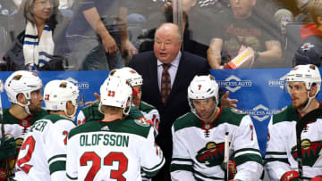 WINNIPEG, MB - NOVEMBER 27: Head Coach Bruce Boudreau of the Minnesota Wild gathers his players at the bench for a pep talk during a third period stoppage in play against the Winnipeg Jets at the Bell MTS Place on November 27, 2017 in Winnipeg, Manitoba, Canada. (Photo by Jonathan Kozub/NHLI via Getty Images)