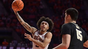 Jan 17, 2022; Champaign, Illinois, USA; Illinois Fighting Illini guard Andre Curbelo (5) drives to the basket during the first half against the Purdue Boilermakers at State Farm Center. Mandatory Credit: Ron Johnson-USA TODAY Sports