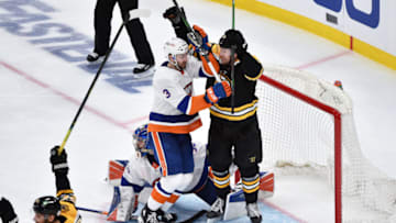 May 29, 2021; Boston, MA, USA; Boston Bruins left wing Nick Ritchie (21) reacts in front of New York Islanders defenseman Adam Pelech (3) after a goal by defenseman Charlie McAvoy (73) (not pictured) during the third period in game one of the second round of the 2021 Stanley Cup Playoffs against the New York Islanders at TD Garden. Mandatory Credit: Bob DeChiara-USA TODAY Sports