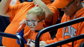 CHAMPAIGN, IL - JANUARY 31: A young fan watches as teams warm up for the Big Ten conference game between the Wisconsin Badgers and the Illinois Fighting Illini on January 31, 2017, at the State Farm Center in Champaign, Illinois. (Photo by Michael Allio/Icon Sportswire via Getty Images)