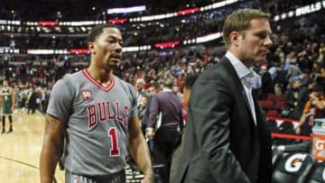 Jan 5, 2016; Chicago, IL, USA; Chicago Bulls guard Derrick Rose (1) and head coach Fred Hoiberg walk off the court after winning 117-106 against the Milwaukee Bucks at United Center. Mandatory Credit: Kamil Krzaczynski-USA TODAY Sports