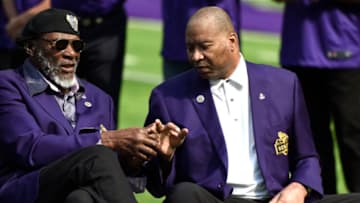 MINNEAPOLIS, MN - SEPTEMBER 23: Former Minnesota Vikings players Carl Eller (L) and Chris Doleman (R) sit on field during the Vikings Ring of Honor induction ceremony for the late coach Dennis Green at halftime of the game against the Buffalo Bills at U.S. Bank Stadium on September 23, 2018 in Minneapolis, Minnesota. Doleman underwent surgery to remove a brain tumor in January 2018. (Photo by Hannah Foslien/Getty Images)
