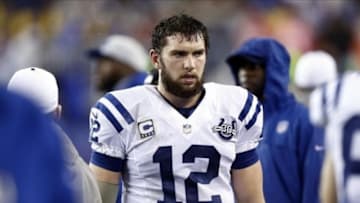 Jan 11, 2014; Foxborough, MA, USA; Indianapolis Colts quarterback Andrew Luck (12) in the first half during the 2013 AFC divisional playoff football game against the New England Patriots at Gillette Stadium. Mandatory Credit: Mark L. Baer-USA TODAY Sports