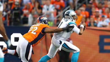 Sep 8, 2016; Denver, CO, USA; Carolina Panthers quarterback Cam Newton (1) is pursued by Denver Broncos nose tackle Sylvester Williams (92) in the first quarter at Sports Authority Field at Mile High. Mandatory Credit: Mark J. Rebilas-USA TODAY Sports