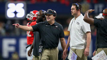 Dec 7, 2019; Atlanta, GA, USA; Georgia Bulldogs head coach Kirby Smart talks to defensive coordinator Dan Lanning against the LSU Tigers in the third quarter in the 2019 SEC Championship Game at Mercedes-Benz Stadium. Mandatory Credit: Brett Davis-USA TODAY Sports
