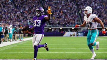 MINNEAPOLIS, MN - DECEMBER 16: Dalvin Cook #33 of the Minnesota Vikings runs with the ball for a 21 yard touchdown, his second of the day, in the fourth quarter of them game against the Miami Dolphins at U.S. Bank Stadium on December 16, 2018 in Minneapolis, Minnesota. (Photo by Adam Bettcher/Getty Images)