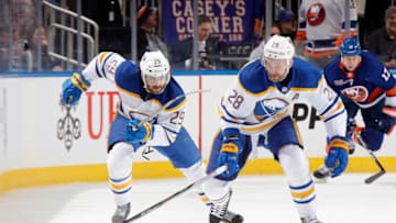 ELMONT, NEW YORK - MARCH 07: Vinnie Hinostroza #29 and Zemgus Girgensons #28 of the Buffalo Sabres skate against the New York Islanders at the UBS Arena on March 07, 2023 in Elmont, New York. (Photo by Bruce Bennett/Getty Images)