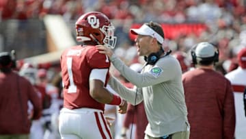 NORMAN, OK - SEPTEMBER 28: Head coach Lincoln Riley congratulates quarterback Jalen Hurts #1 of the Oklahoma Sooners after a touchdown against the Texas Tech Red Raiders at Gaylord Family Oklahoma Memorial Stadium on September 28, 2019 in Norman, Oklahoma. The Sooners defeated the Red Raiders 55-16. (Photo by Brett Deering/Getty Images)