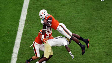 Nov 5, 2016; Miami Gardens, FL, USA; Miami Hurricanes tight end David Njoku (86) leaps over Pittsburgh Panthers defensive back Terrish Webb (2) for a touchdown during the first half at Hard Rock Stadium. Mandatory Credit: Steve Mitchell-USA TODAY Sports