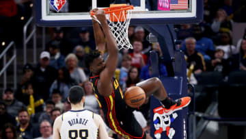 INDIANAPOLIS, INDIANA - MARCH 28: Clint Capela #15 of the Atlanta Hawks dunks the ball past Goga Bitadze #88 of the Indiana Pacers in the second quarter at Gainbridge Fieldhouse on March 28, 2022 in Indianapolis, Indiana. NOTE TO USER: User expressly acknowledges and agrees that, by downloading and or using this Photograph, user is consenting to the terms and conditions of the Getty Images License Agreement. (Photo by Dylan Buell/Getty Images)