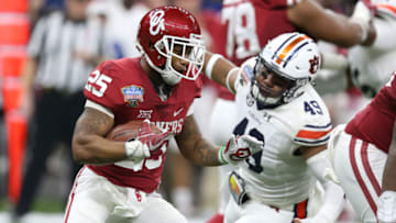 Auburn footballJan 2, 2017; New Orleans , LA, USA; Oklahoma Sooners running back Joe Mixon (25) carries the ball against Auburn Tigers linebacker Darrell Williams (49) in the second quarter at the Mercedes-Benz Superdome. Mandatory Credit: Chuck Cook-USA TODAY Sports
