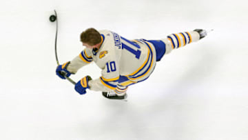 Mar 25, 2022; Buffalo, New York, USA; Buffalo Sabres defenseman Henri Jokiharju (10) takes a shot on goal during warmups before a game against the Washington Capitals at KeyBank Center. Mandatory Credit: Timothy T. Ludwig-USA TODAY Sports
