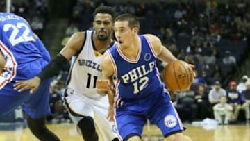 Nov 29, 2015; Memphis, TN, USA; Philadelphia 76ers guard TJ McConnell (12) drives against Memphis Grizzlies guard Mike Conley (11) at FedExForum. Memphis defeated Phiadelphia 92-84. Mandatory Credit: Nelson Chenault-USA TODAY Sports
