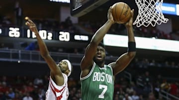 Dec 5, 2016; Houston, TX, USA; Boston Celtics forward Jaylen Brown (7) scores a basket as Houston Rockets forward Corey Brewer (33) defends during the second quarter at Toyota Center. Mandatory Credit: Troy Taormina-USA TODAY Sports
