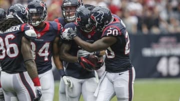 Sep 29, 2013; Houston, TX, USA; Houston Texans cornerback Johnathan Joseph (24) is congratulated by free safety Ed Reed (20) after making an interception during the fourth quarter against the Seattle Seahawks at Reliant Stadium. The Seahawks defeated the Texans 23-20. Mandatory Credit: Troy Taormina-USA TODAY Sports