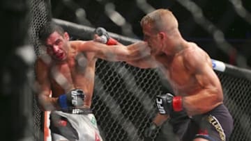 Jul 25, 2015; Chicago, IL, USA; Renan Barao (blue gloves) fights against TJ Dillashaw (red gloves) during UFC Fight Night at United Center. Mandatory Credit: Dennis Wierzbicki-USA TODAY Sports