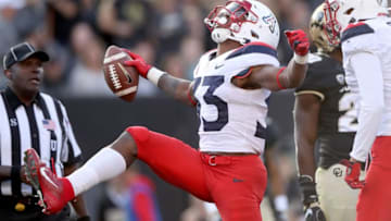 BOULDER, COLORADO - OCTOBER 05: Nathan Tilford #33 of the Arizona Wildcats celebrates scoring a touchdown against the Colorado Buffaloes in the third quarter at Folsom Field on October 05, 2019 in Boulder, Colorado. (Photo by Matthew Stockman/Getty Images)