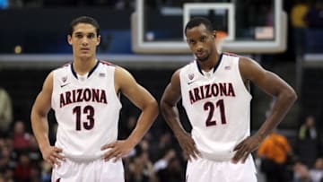 LOS ANGELES, CA - MARCH 09: Nick Johnson #13 stands alongside teammate Kyle Fogg #21 of the Arizona Wildcats late in the second half while taking on the Oregon State Beavers in the semifinals of the 2012 Pacific Life Pac-12 men's basketball tournament at Staples Center on March 9, 2012 in Los Angeles, California. (Photo by Stephen Dunn/Getty Images)