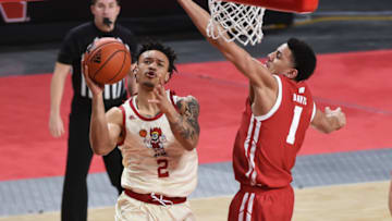 Feb 10, 2021; Lincoln, Nebraska, USA; Nebraska Cornhuskers guard Trey McGowens (2) drives against Wisconsin Badgers guard Jonathan Davis (1) in the first half at Pinnacle Bank Arena. Mandatory Credit: Steven Branscombe-USA TODAY Sports