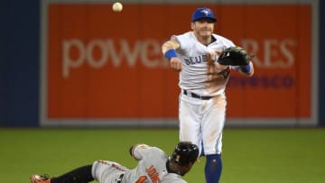 Sep 28, 2016; Toronto, Ontario, CAN; Toronto Blue Jays third baseman Josh Donaldson (20) throws to first base to complete a double play after forcing out Baltimore Orioles center fielder Adam Jones (10) in the ninth inning at Rogers Centre. Mandatory Credit: Dan Hamilton-USA TODAY Sports