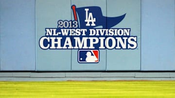 LOS ANGELES, CA - SEPTEMBER 28: The Los Angeles Dodgers unvail their 2013 National League West Division Championship banner before the game against the Colorado Rockies at Dodger Stadium on September 27, 2013 in Los Angeles, California. (Photo by Lisa Blumenfeld/Getty Images)