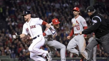 Oct 30, 2013; Boston, MA, USA; Boston Red Sox center fielder Jacoby Ellsbury (left) gets back to first base past the attempted tag in a run down by St. Louis Cardinals relief pitcher Kevin Siegrist (middle) in the fifth inning during game six of the MLB baseball World Series at Fenway Park. Mandatory Credit: Robert Deutsch-USA TODAY Sports