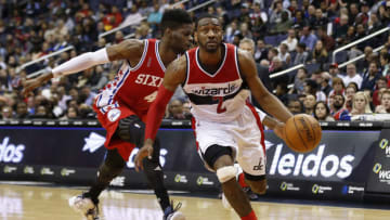 Wizards guard John Wall (2) drives to the basket past Philadelphia 76ers forward Nerlens Noel (4). Mandatory Credit: Geoff Burke-USA TODAY Sports