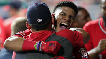 PHILADELPHIA, PA - JULY 13: Juan Soto #22 of the Washington Nationals celebrates with teammates in the dugout after hitting a go-ahead two-run home run in the ninth inning during a game against the Philadelphia Phillies at Citizens Bank Park on July 13, 2019 in Philadelphia, Pennsylvania. The Nationals won 4-3. (Photo by Hunter Martin/Getty Images)